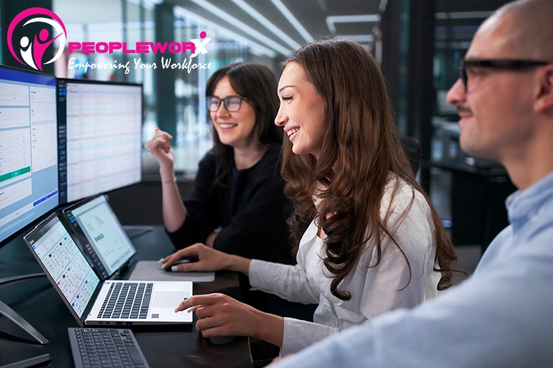 Diverse team members, digital payroll interface, charts-graphs showing automated workflows