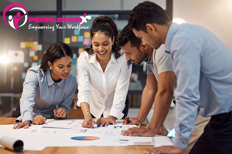 Small business owner reviewing growth and workforce plans in 2026