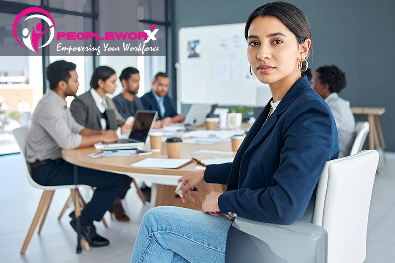 A small leadership or HR operations team in a collaborative planning meeting