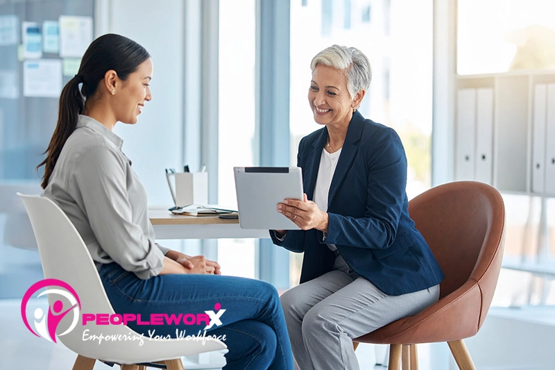 HR professional guiding an employee through benefits choices