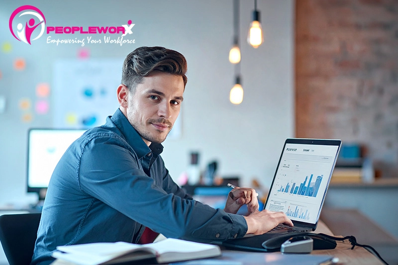 HR professional reviewing AI-supported employee data with human oversight