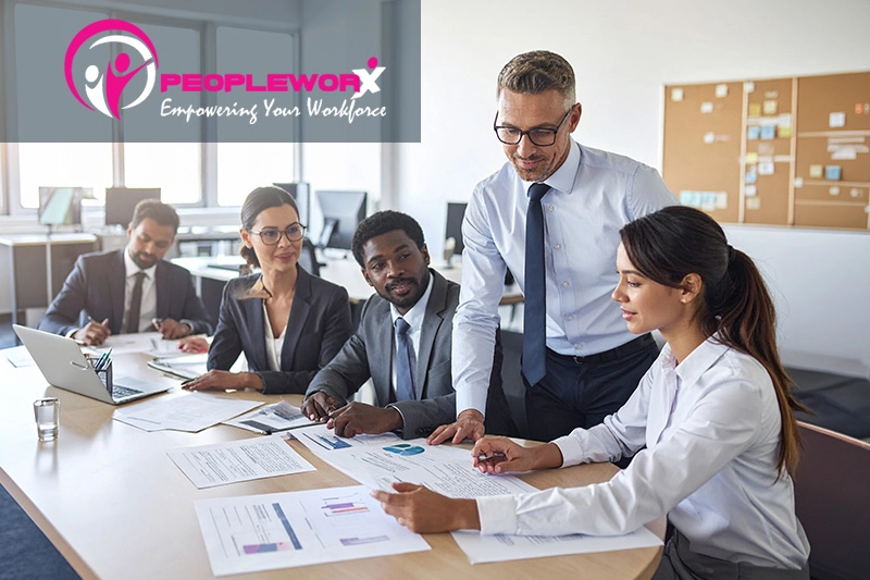 Small business leaders reviewing payroll and HR processes together