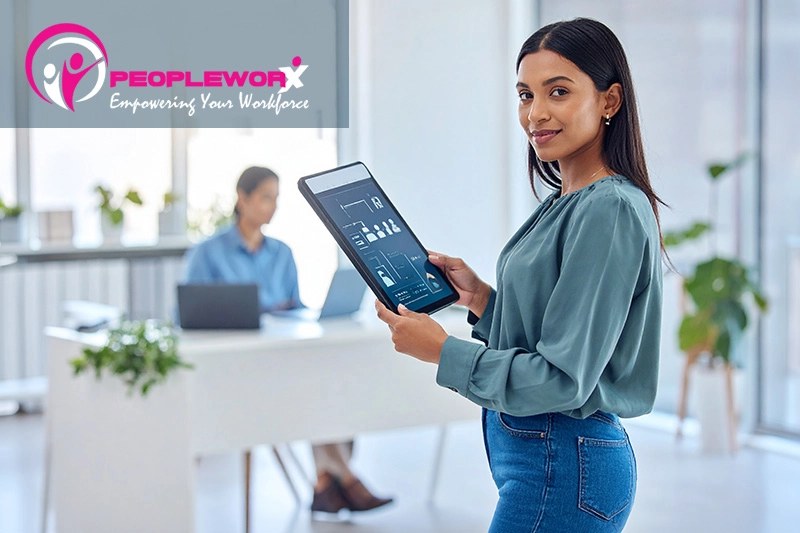 Small business owner reviewing AI-supported HR technology for employee processes
