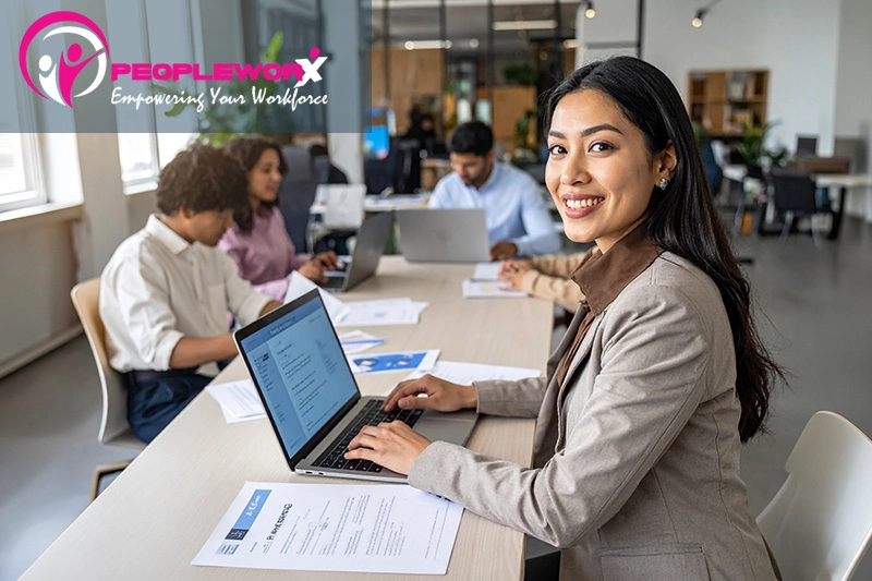 Small business team reviewing job candidates using digital hiring tools